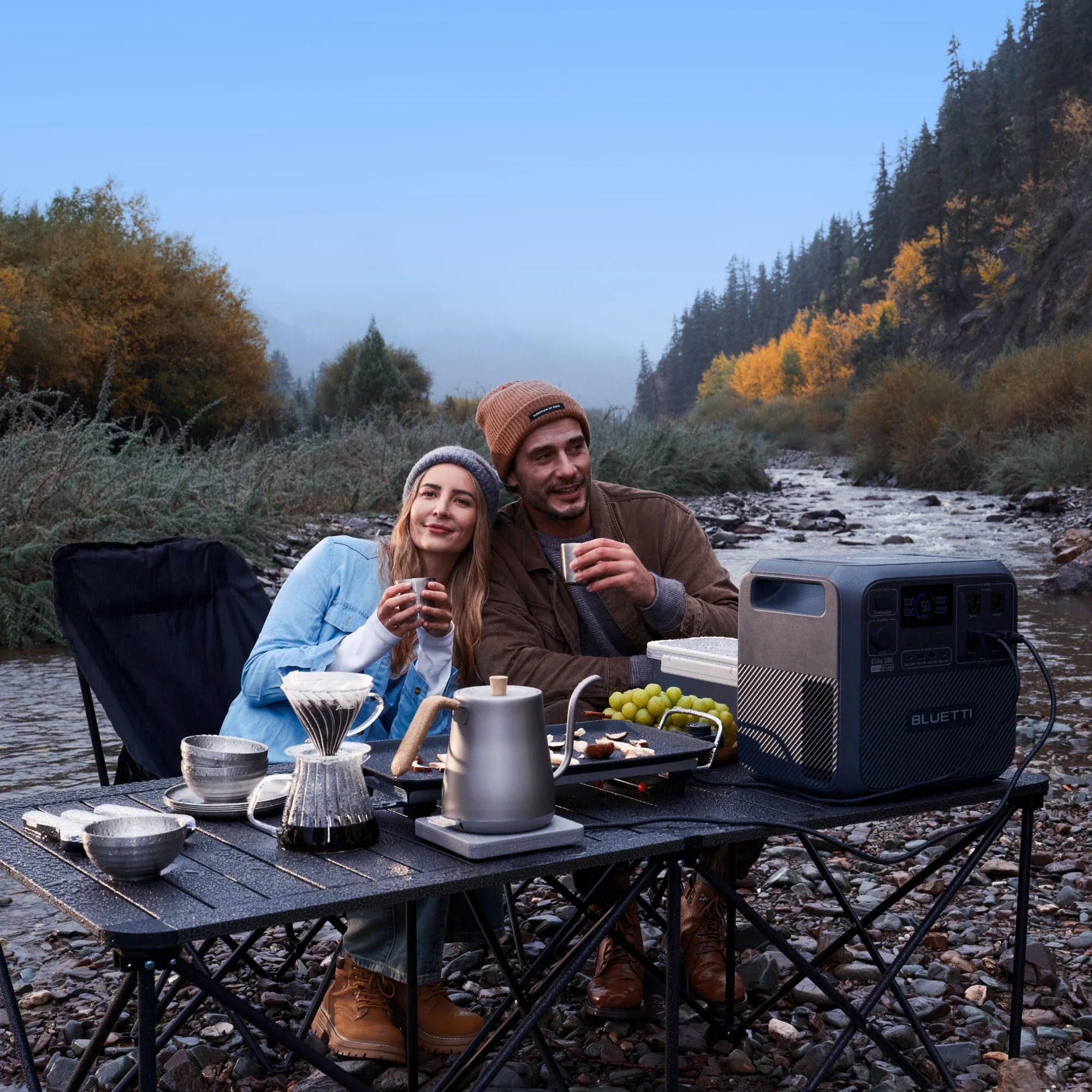 BLUETTI Elite 200 power station powering devices during mountain camping trip